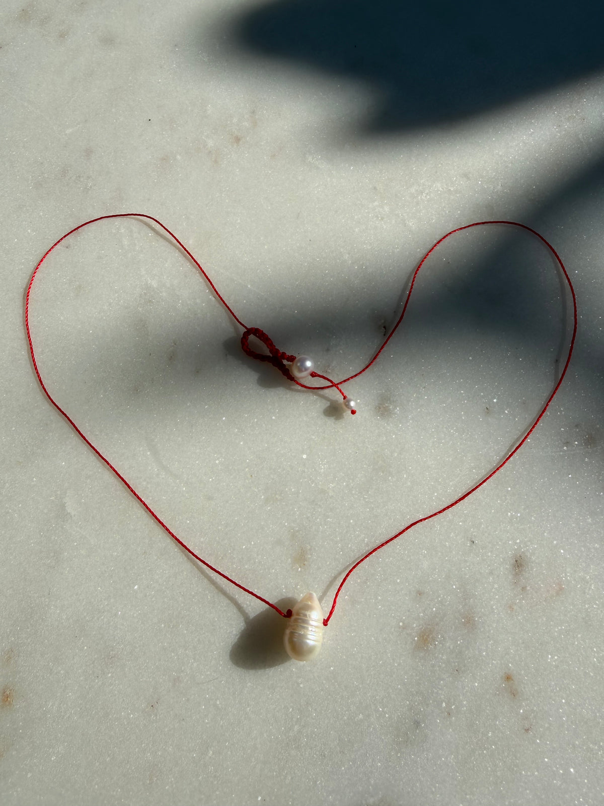 Future Nomads Necklaces Red Thread Pearl Drop