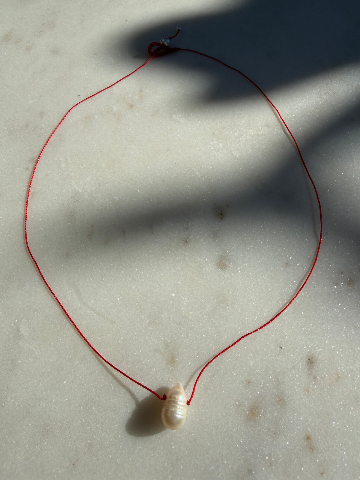 Future Nomads Necklaces Red Thread Pearl Drop