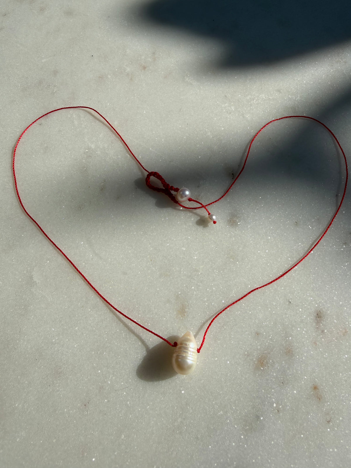 Future Nomads Necklaces Red Thread Pearl Drop